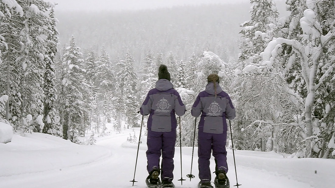 Winter: q section  woman snowshoeing 